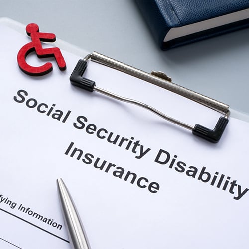 A clipboard with a Social Security Disability Insurance form on it