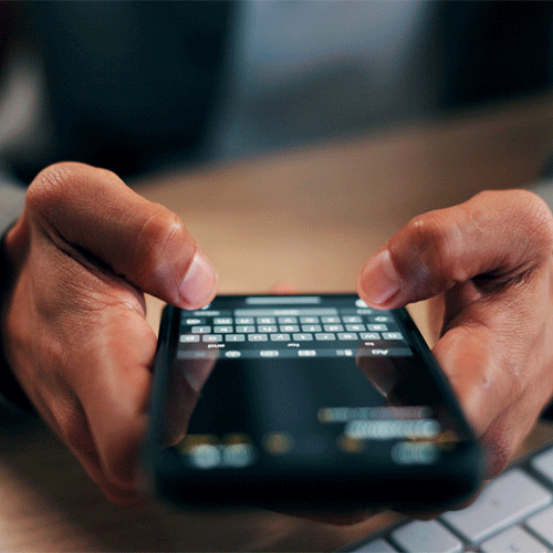 A person texting on a phone